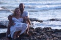 Pregnant couple walking on the beach