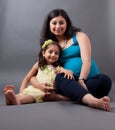 Pregnant East Indian Woman with her Daughter