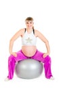 Pregnant female doing exercises on fitness ball Royalty Free Stock Photo