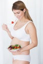 Pregnant female leading healthy lifestyle