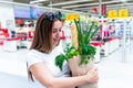 Pregnant food bag supermarket. Pregnancy woman with healthy lettuce salad leaves, fresh tomato in market food bag on Royalty Free Stock Photo