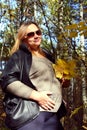 Pregnant girl in the autumn forest