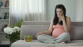 Pregnant girl eating vegetable salad, feeling sickness, suffering toxicosis