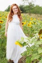 Pregnant girl in the field with sunflowers Royalty Free Stock Photo