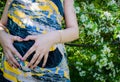 A pregnant girl hugs her belly with two hands Royalty Free Stock Photo