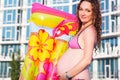 Pregnant girl with mattress near swimmimg pool Royalty Free Stock Photo