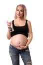 Pregnant girl posing with bottle of water. Close up. White background Royalty Free Stock Photo