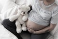 Pregnant girl putting hands on tummy Royalty Free Stock Photo