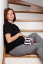 Pregnant girl showing image of ultrasound scan Royalty Free Stock Photo