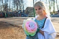 Pregnant girl is walking around the city park in spring Royalty Free Stock Photo