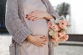 Pregnant girl walking near the fountain. Happy and carefree pregnancy Royalty Free Stock Photo