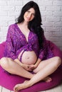 Pregnant girl is wearing underwear Royalty Free Stock Photo