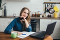 Pregnant girl works at home in self-isolation mode in quarantine and makes online purchases Royalty Free Stock Photo