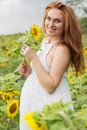 Pregnant happy girl in sunflowers field Royalty Free Stock Photo