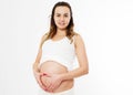 Pregnant happy Woman touching her belly. Pregnant middle aged mother portrait, caressing her belly and smiling close-up on white Royalty Free Stock Photo