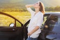 Pregnant happy young woman near car on the nature Royalty Free Stock Photo