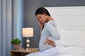 Pregnant, headache and back pain of a woman in her home bedroom thinking about stress or anxiety. Person on bed with Royalty Free Stock Photo
