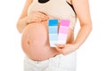 Pregnant holding colour paint samples. Close-up. Royalty Free Stock Photo
