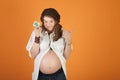 Pregnant Lady with Condom Royalty Free Stock Photo