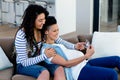 Pregnant lesbian couple looking at sonography report Royalty Free Stock Photo