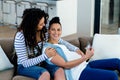 Pregnant lesbian couple looking at sonography report Royalty Free Stock Photo