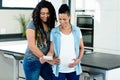 Pregnant lesbian couple looking at sonography report