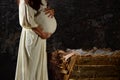 Pregnant Mary in Front of Manger Royalty Free Stock Photo