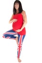 Pregnant model wearing British leggings standing on one foot