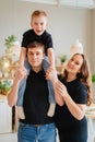 pregnant mom, dad rides son on shoulders. games and relationships with children Royalty Free Stock Photo