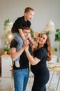 pregnant mom, dad rides son on shoulders. games and relationships with children Royalty Free Stock Photo