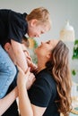 pregnant mom, dad rides son on shoulders. games and relationships with children Royalty Free Stock Photo