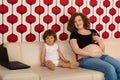 Pregnant mom and toddler boy home Royalty Free Stock Photo