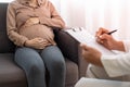 The pregnant mother is discussing depression symptoms during pregnancy with a specialist doctor or psychiatrist