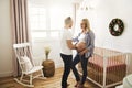 Pregnant Mother and her husband on the baby room at home Royalty Free Stock Photo