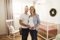 Pregnant Mother and her husband on the baby room at home Royalty Free Stock Photo