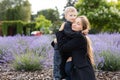 Pregnant mother and her little son spending time together in the park, hugging and smiling Royalty Free Stock Photo