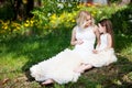 Pregnant mother and her small daughter have fun outdoor. Family look portrait Royalty Free Stock Photo