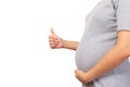 Pregnant mother holding belly and give thumb up with isolated on white background copy space. Pregnancy woman and her baby or Royalty Free Stock Photo