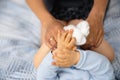 Pregnant Mother laying with her baby son on the bedroom bed playing and having fun - Asian mixed ethnicity child Boy Royalty Free Stock Photo