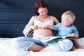 Pregnant mother and son at home. Royalty Free Stock Photo