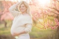 Pregnant pretty woman in spring blossom garden Royalty Free Stock Photo