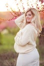 Pregnant pretty woman in spring blossom garden Royalty Free Stock Photo