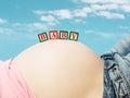 Pregnant's woman belly with a toy blocks Royalty Free Stock Photo