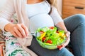 Pregnant salad healthy food. Pregnancy woman eating nutrition diet food salad. Family nutrition, healthy eating concept. Royalty Free Stock Photo