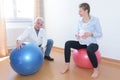 Pregnant sitting on exercise ball breathing in clinc Royalty Free Stock Photo