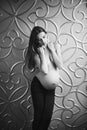 Pregnant skinny women model in business office style cloth topless