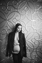 Pregnant skinny women model in business office style cloth topless