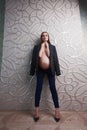 Pregnant skinny women model in business office style cloth topless