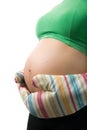 Pregnant stomach with mitts Royalty Free Stock Photo