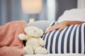 Pregnant stomach, teddy bear and mother in bed with toy for baby, infant and affection at home. Pregnancy love, family Royalty Free Stock Photo